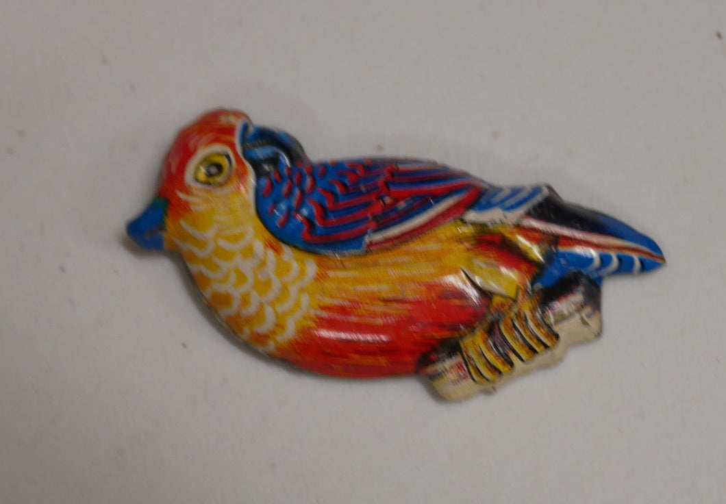 Metal broche med fugl