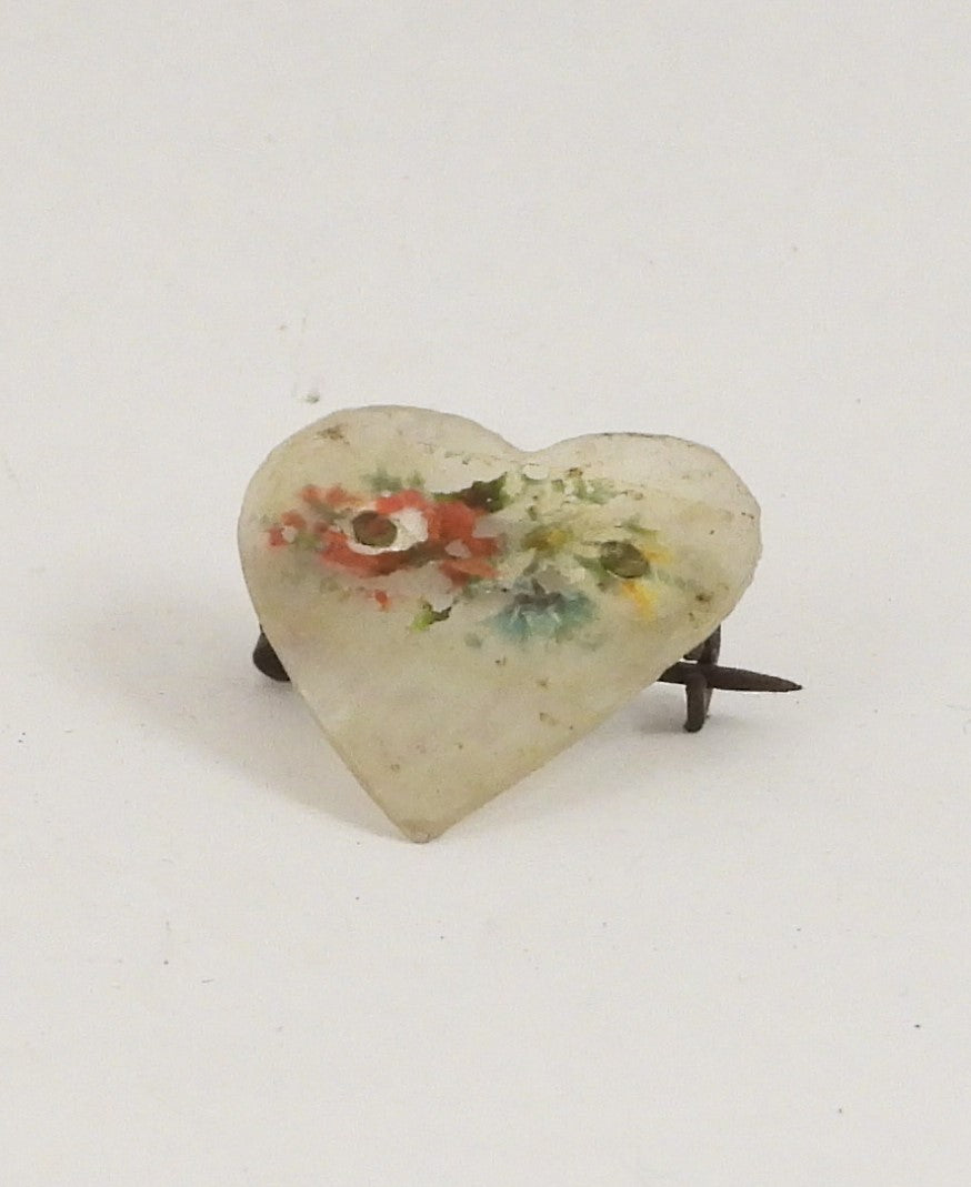 Fin broche med blomster på