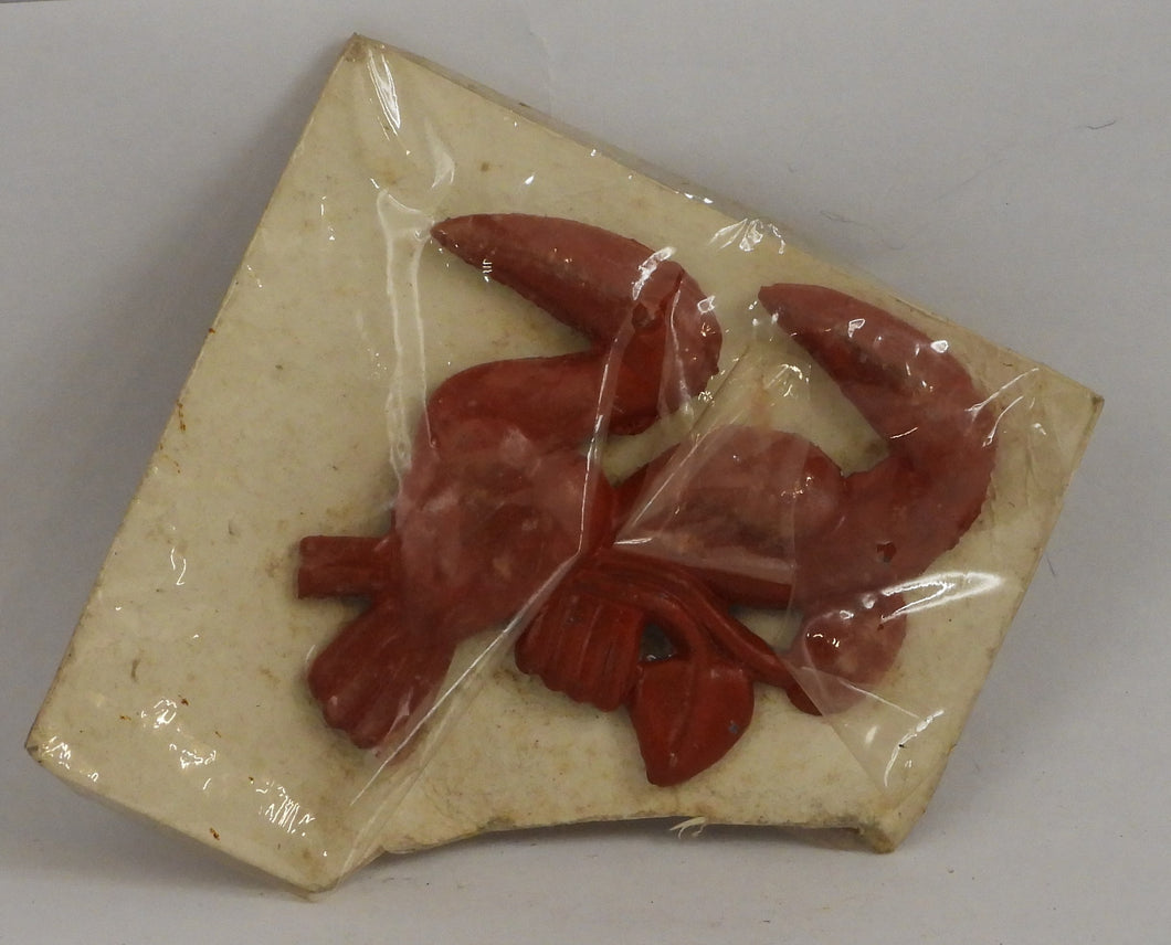 Gammel broche med tukaner