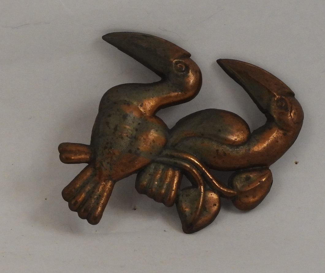 Gammel broche med tukaner